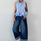 Sleeveless blouse with ruffles - light blue