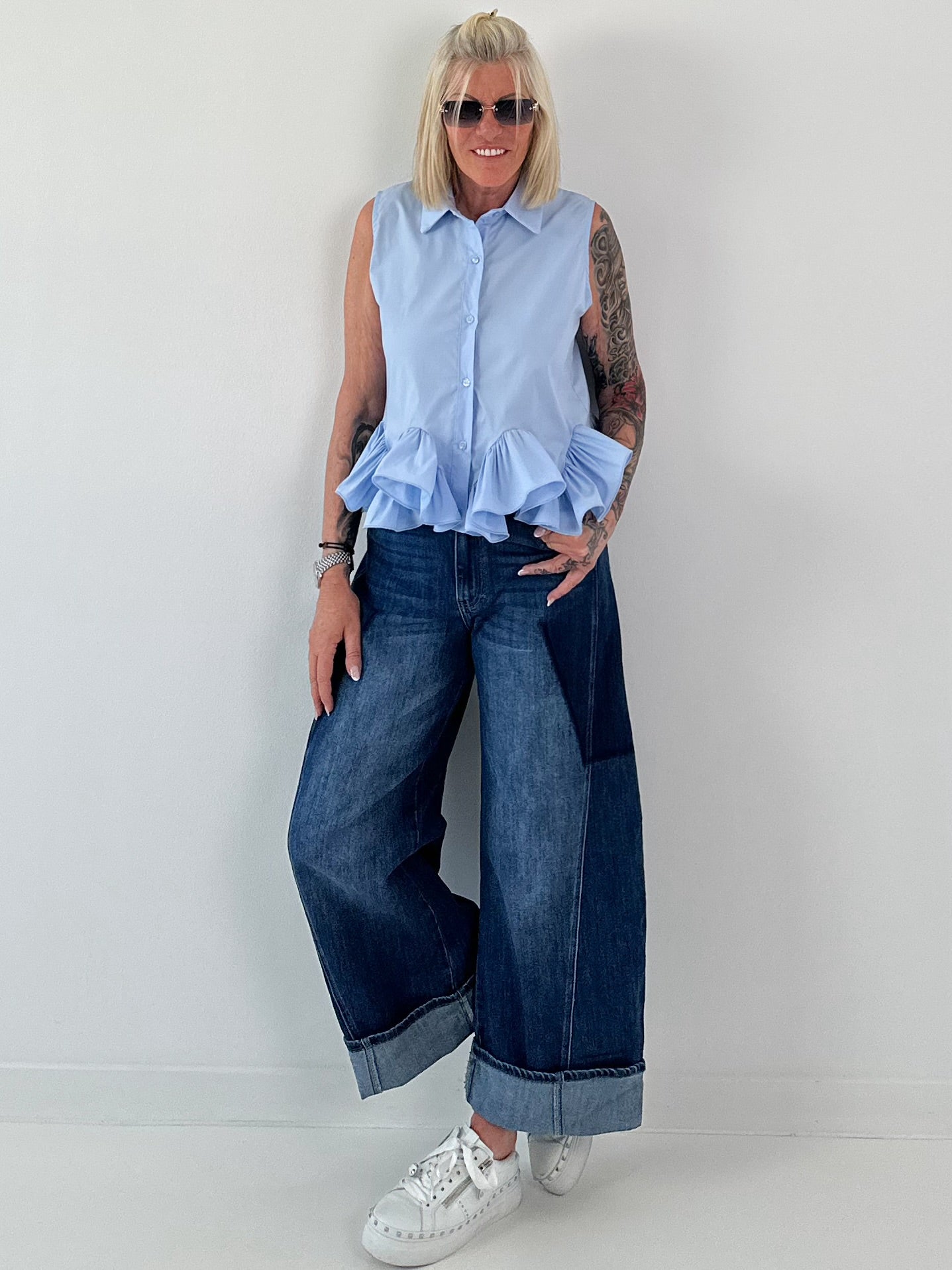 Sleeveless blouse with ruffles - light blue