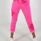 Broek met gehaakte bloemen - neonroze