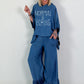 Dark blue jeans with flounced hem