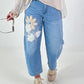 Bottle jeans with floral appliqués - denim