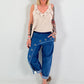 Dark blue jeans with silver eyelets