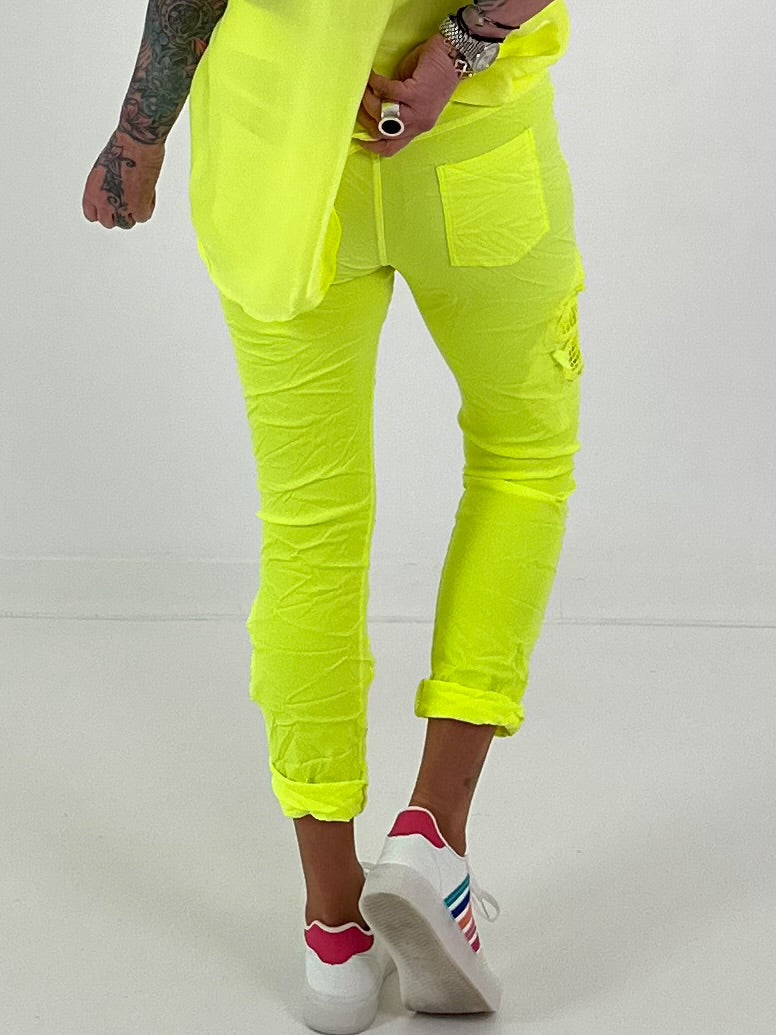 Pants with crocheted flowers - neon yellow