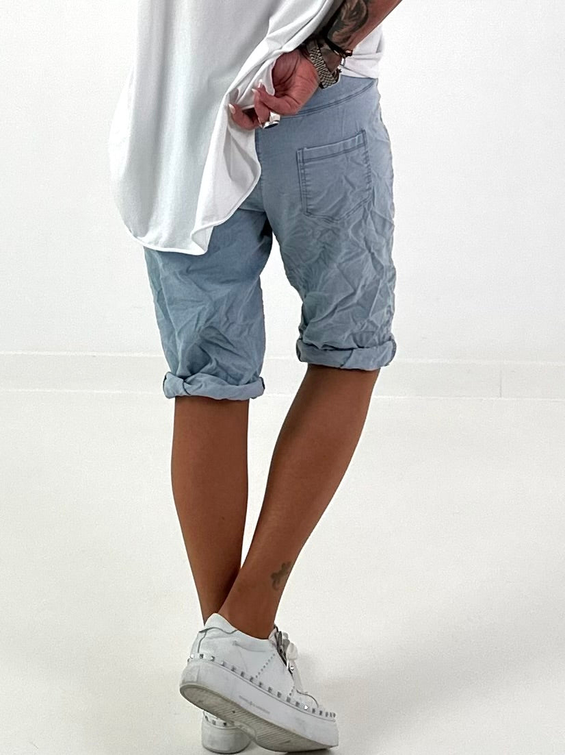 Short baggy jeans with eyelet details - light blue (available from 05/15/26)