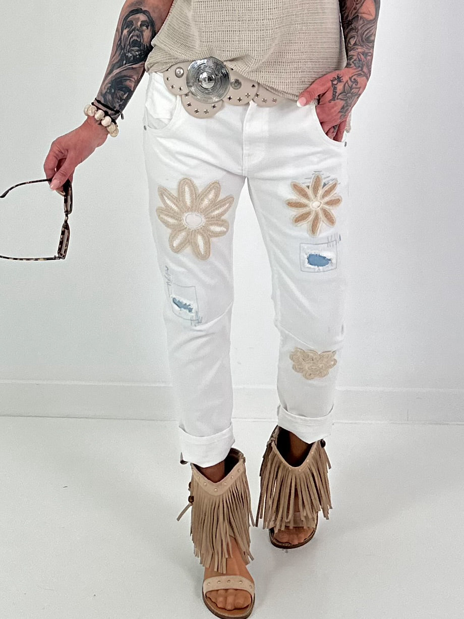 Jeans with crocheted floral appliqués - white