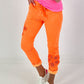 Trousers with crochet flowers - neon orange