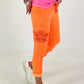 Trousers with crochet flowers - neon orange