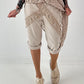 Kurze Hose mit Jeanselementen und Ösen - beige
