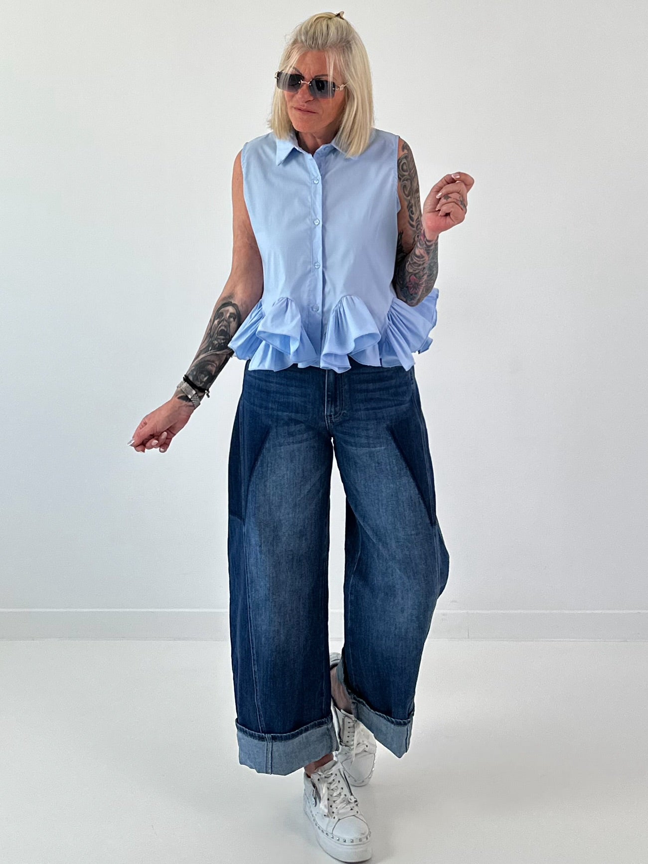 Sleeveless blouse with ruffles - light blue