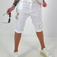 Short baggy shorts with crochet flowers and sequins - white