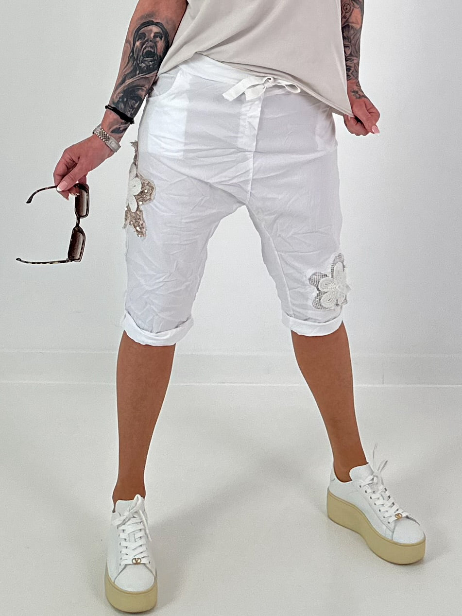 Short baggy shorts with crochet flowers and sequins - white