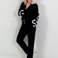 Trousers with wide pleats - black