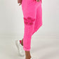 Broek met gehaakte bloemen - neonroze