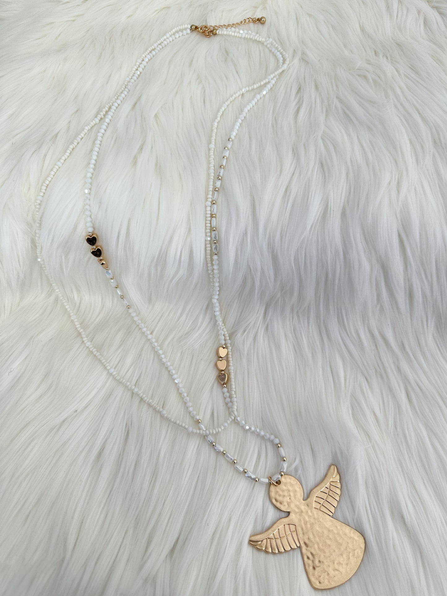Necklace with angel pendant - white gold