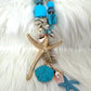 Shell necklace with starfish pendant - light blue