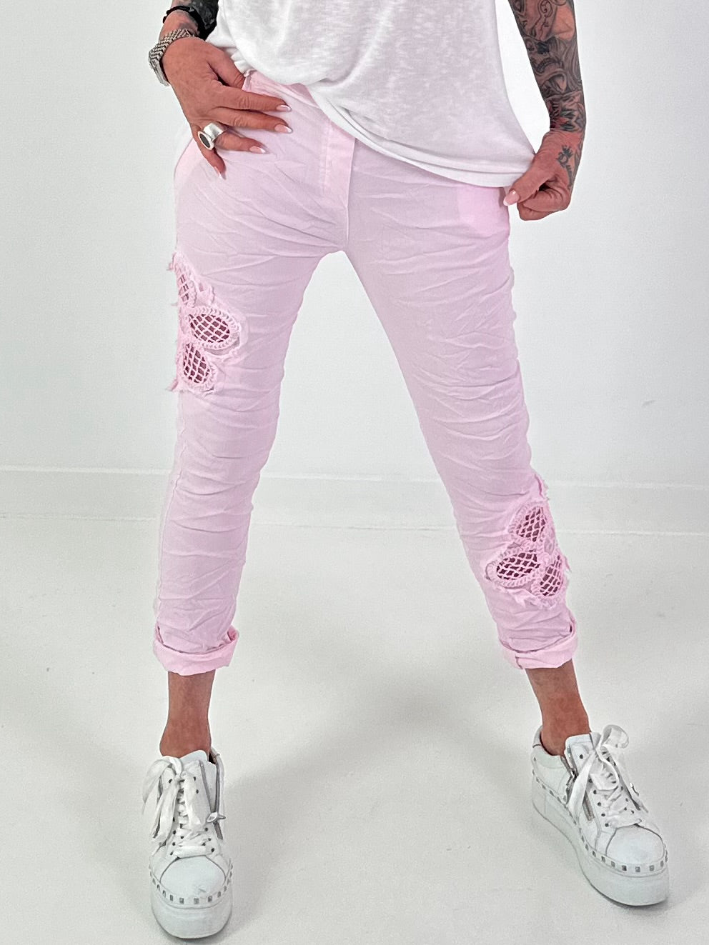 Trousers with crocheted flower inserts - pink