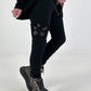 Trousers with crocheted flower inserts - black