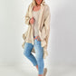 Oversized blouse met ruches – beige