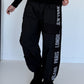 Hose mit City-Statement-Print - schwarz