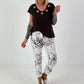 All-over patterned trousers - white-multicoloured