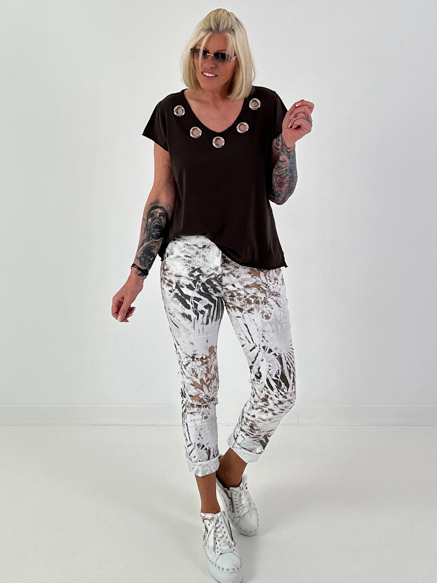 All-over patterned trousers - white-multicoloured
