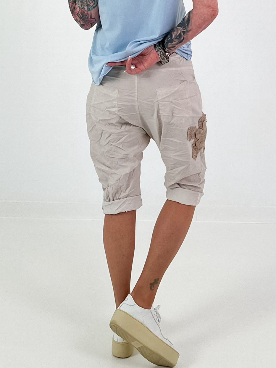 Short Baggy Shorts with Crocheted Flowers and Sequins - Beige