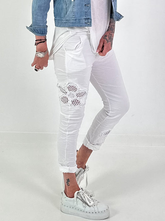Trousers with crocheted flower inserts - white