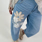 Bottle jeans with floral appliqués - denim