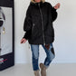 Oversized Steppjacke mit Stulpenärmeln und Kapuze - schwarz
