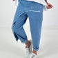 Jeanshose mit silbernen Ösen - hellblau