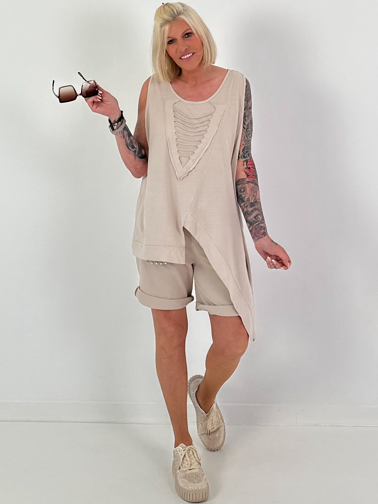 Top with cut-out and asymmetrical hem - beige