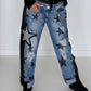 Boyfriend Jeans mit allover Sternen-Print und Ledereinsätzen - schwarz-denim
