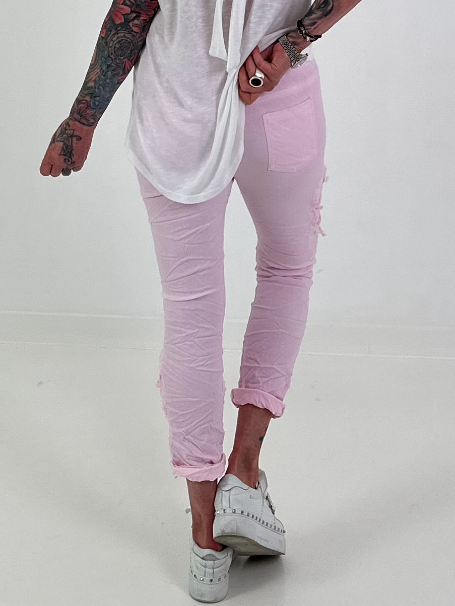 Trousers with crocheted flower inserts - pink