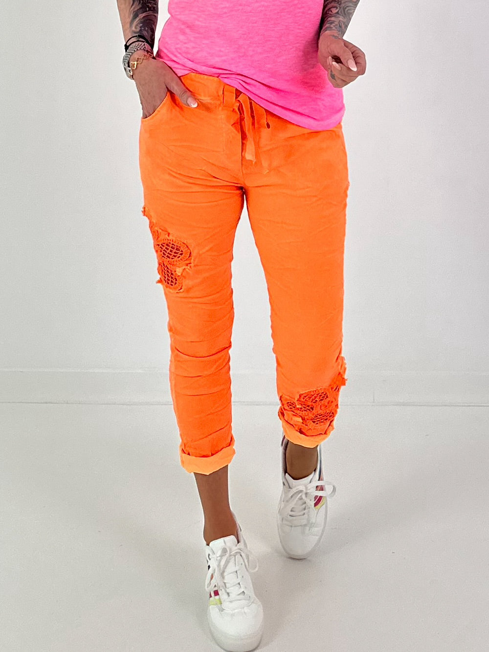 Trousers with crochet flowers - neon orange