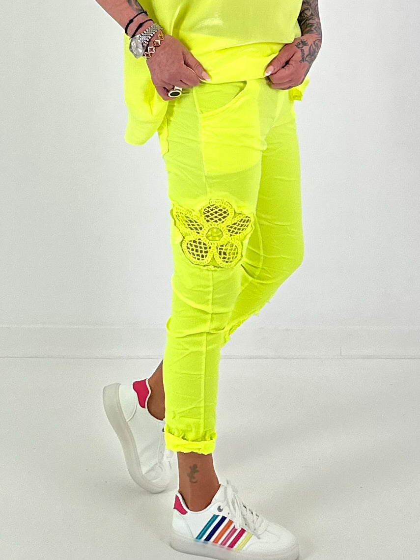 Pants with crocheted flowers - neon yellow