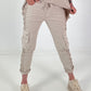 Trousers with crochet flowers and patch pockets - beige