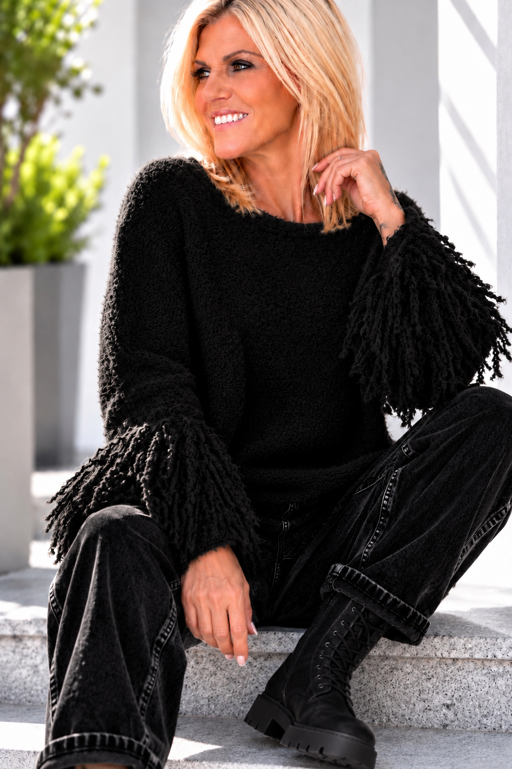 Fringe-look sweater with trumpet sleeves - black