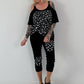 Shirt mit Cold Shoulder und Leo Strass - schwarz