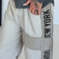 Hose mit City-Statement-Print - beige