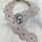 Decorative belt with stud and eyelet details - beige