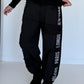 Hose mit City-Statement-Print - schwarz