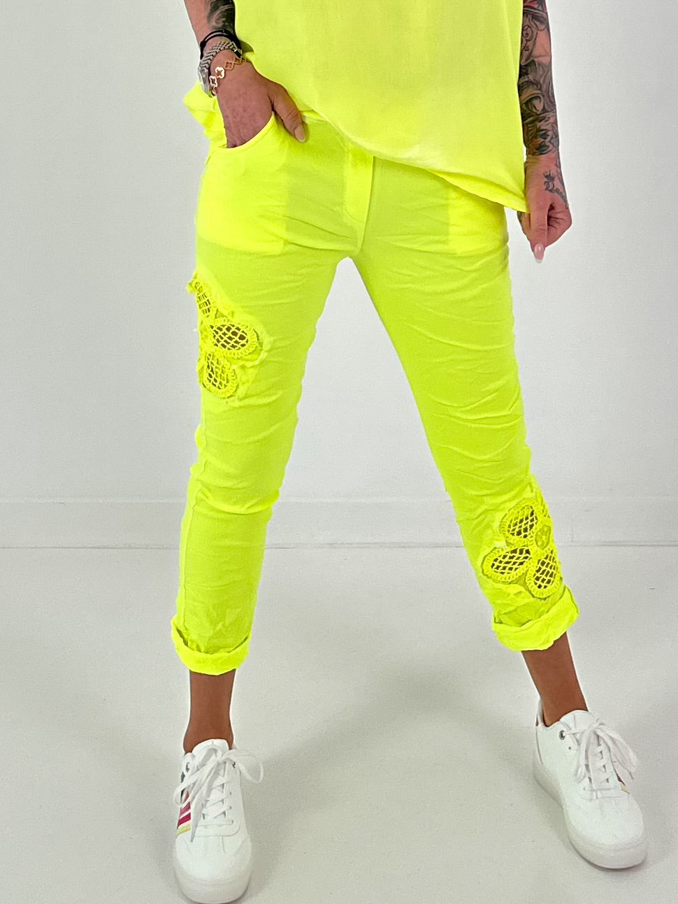 Pants with crocheted flowers - neon yellow