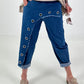 Dark blue jeans with silver eyelets