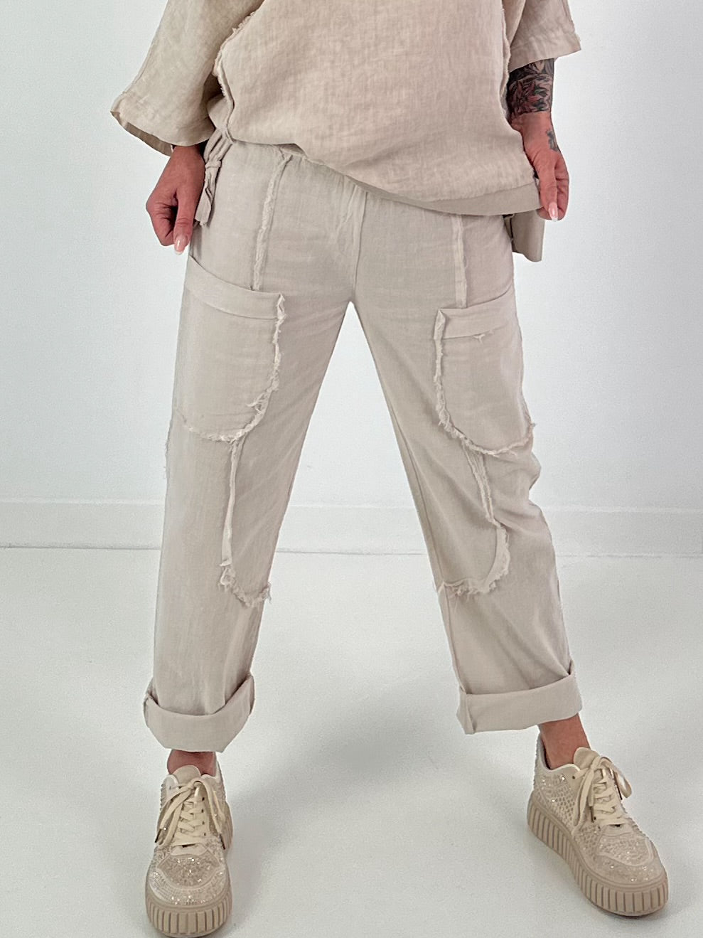 Linnen broek met opgestikte zakken en franjes - beige