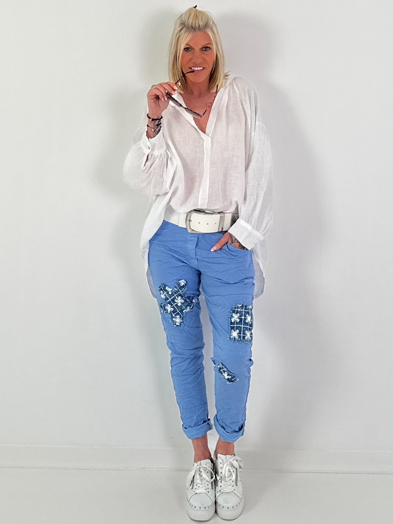 Light blue jeans with denim and sequin details