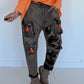 Baggy-Jeans in Used-Optik mit Camouflage-Applikationen - used-denim