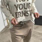 Shirt mit Leo Druck und Glitzersteinchen "Not Your Ernst" - beige