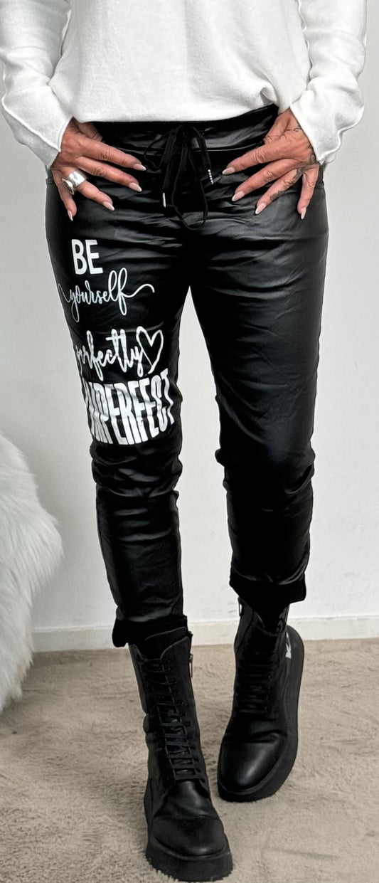 Imitation leather trousers "Be Yourself...." - black