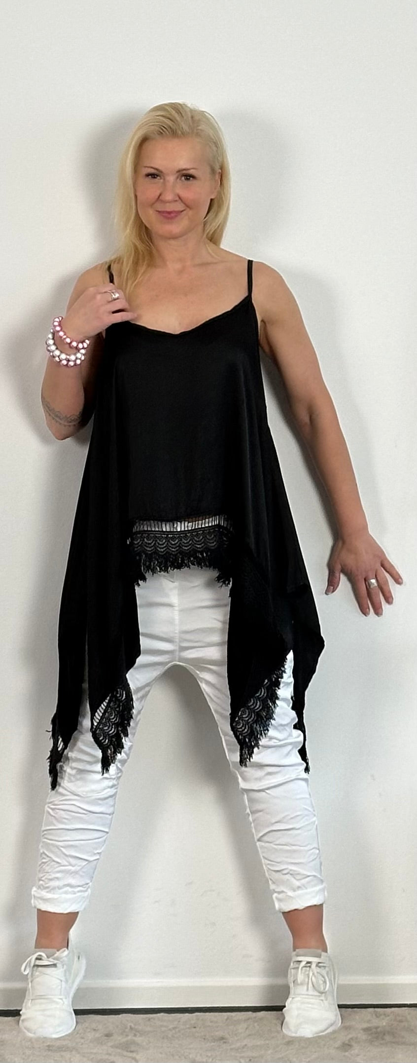 Shiny long top with crochet cuffs and fringes "Malu" - black