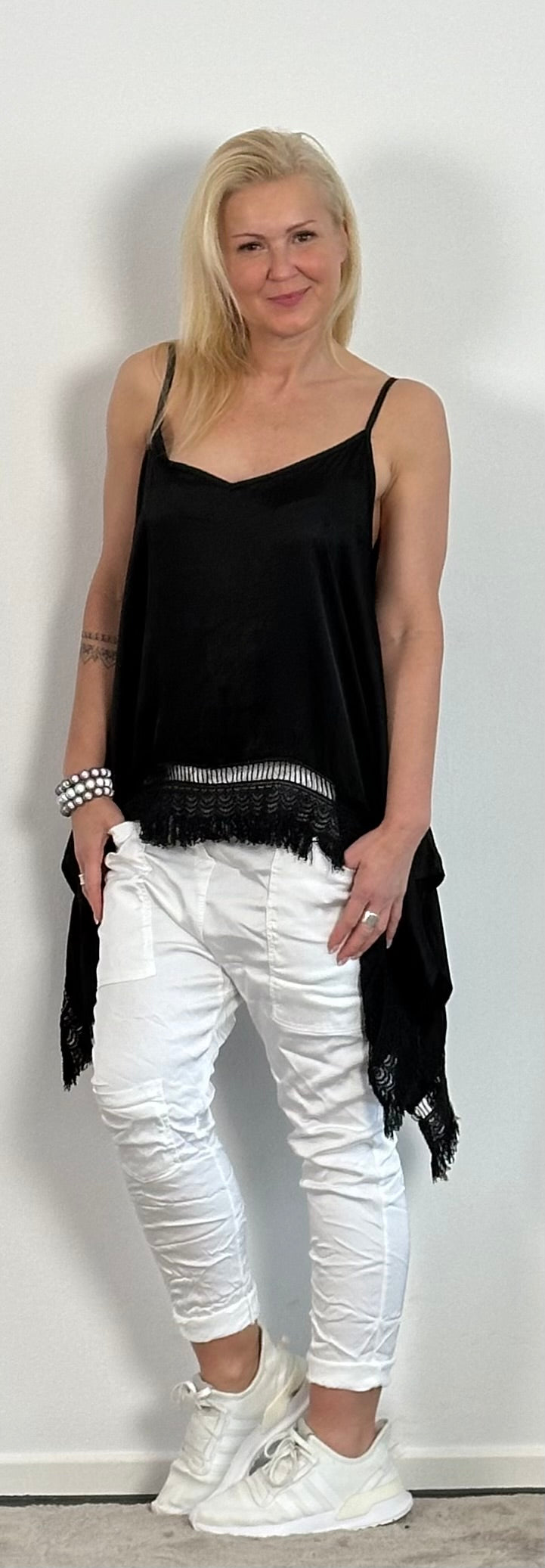 Shiny long top with crochet cuffs and fringes "Malu" - black